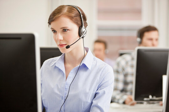 Colleagues working in a call center with a very friendly atmosphere. Munich, Germany