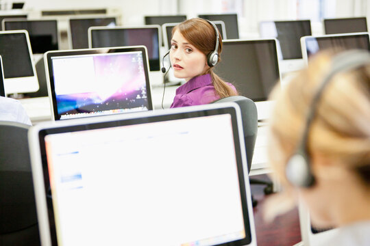 Colleagues working in a call center with a very friendly atmosphere. Munich, Germany