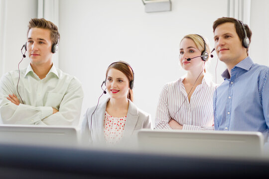 Colleagues working in a call center with a very friendly atmosphere. Munich, Germany