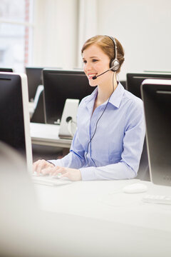 Colleagues working in a call center with a very friendly atmosphere. Munich, Germany