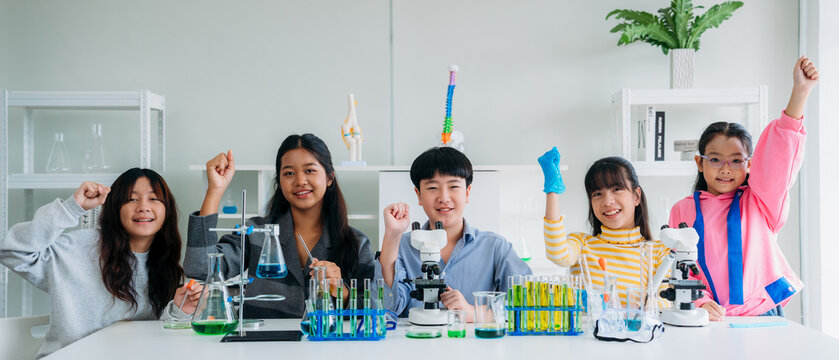 Group of Primary class children engaged in hands-on scientific experiments. Students discovering the wonders of science through interactive and engaging experiments.