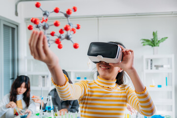 Child Explores Molecular Models with VR Glasses. Girl Wearing Reality Headset Interacts with 3D Molecule. Immersive STEM Education.