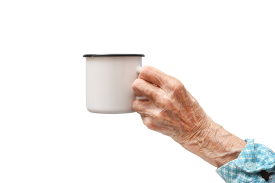 A woman holds a mug in her hand.Rheumatoid polyarthritis of the hand of a 95-year-old woman, isolated on a white background. 