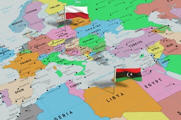 Poland and Libya - pin flags on political map - 3D illustration