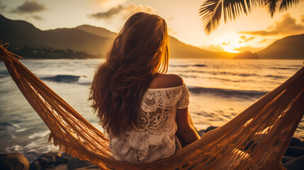 a woman sitting in a hammock overlooking a beach - Powered by Adobe