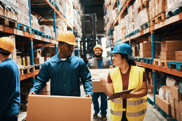 Logistics team working together in a warehouse