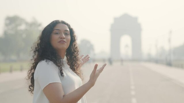 Indian Girl with Curly Hair Talking to Camera at India Gate