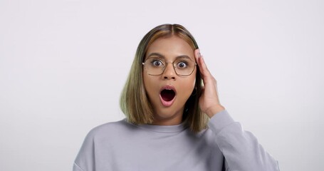 Wow, surprise and face of woman in studio with drama, gossip or shocking news on white background. Omg, portrait and female model with mind blown emoji for announcement, secret or unexpected info - Powered by Adobe