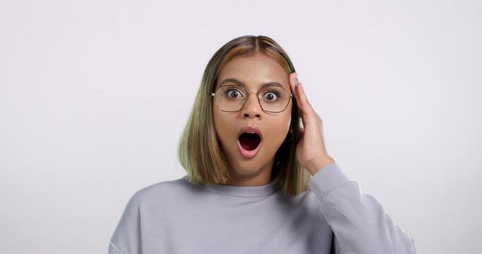 Wow, surprise and face of woman in studio with drama, gossip or shocking news on white background. Omg, portrait and female model with mind blown emoji for announcement, secret or unexpected info