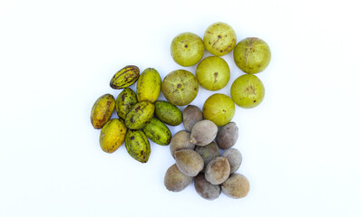 Indian gooseberry,Terminalia bellirica and Terminalia chebula fruits on white background close-up view 