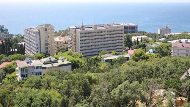 Roofs of buildings in small resort town near sea shore at summer