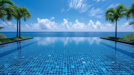 Luxury infinity pool overlooking the ocean with palm trees and blue sky