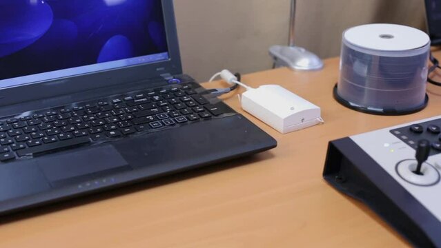 Remote control panel and notebooks at table in doctor room.