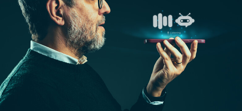 Man Interacting with AI Assistant on Smartphone - Senior dialoguing with artificial intelligence. 
