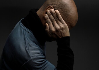 deafness suffering from hearing loss on grey black background with people stock image stock photo	