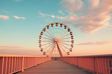 Behangcirkel As the sun sets on the wooden boardwalk, the vibrant colors of the sky reflect on the towering ferris wheel, a symbol of the lively tourist attraction and excitement that awaits at the amusement park © familymedia