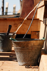 Sur, Oman -  February 6, 2016 - Buckets on Dhow under construction.