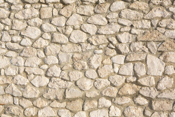 Background of stone wall texture photo. Close-up of stone wall.