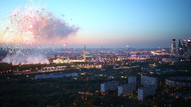 city business complex and Victory Park Memorial with fireworks