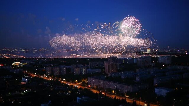 Residential district of city with fireworks at evening