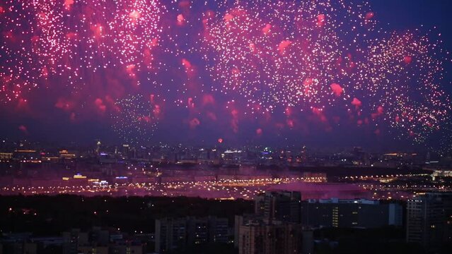 Residential district of city with fireworks during holiday 