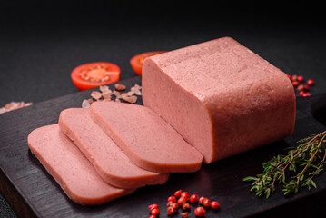 Delicious canned pink ham with salt, spices and herbs