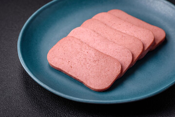 Delicious canned pink ham with salt, spices and herbs