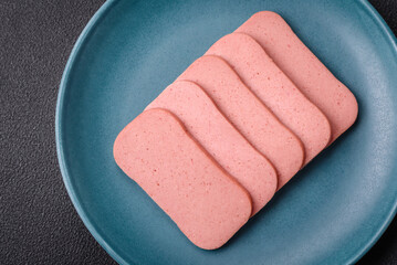 Delicious canned pink ham with salt, spices and herbs