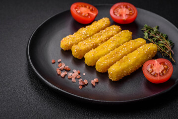 Delicious crispy cheese sticks with mozzarella, salt and spices, breaded and fried in oil