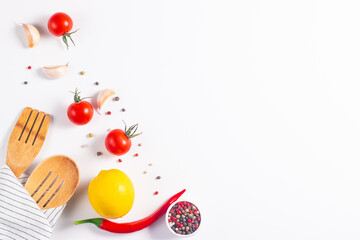 White cooking background with spices, vegetables and utensils. Top view. Free space for your text.