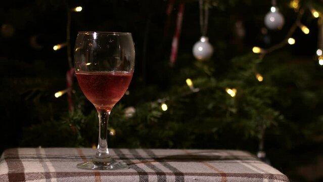 Glass of red wine on Christmas background