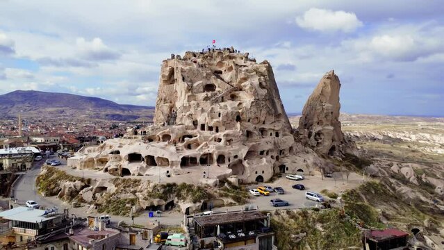 Drone view captures Uchisar Castle, a cultural icon in Turkey. Uchisar's rich history showcased in Turkey's majestic landscape. Turkey's heritage reflected in Uchisar, a jewel of Cappadocia