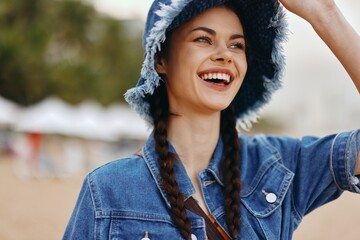 Fototapeta premium Happy Young Female Portrait - Fashionable Smiling Lady with Pretty White Hat in Cheerful Outdoor Fun
