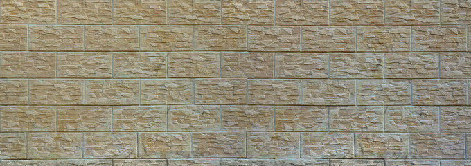 Wall of light texture tiles, stylized in appearance as a brick. One of the types of wall decoration
