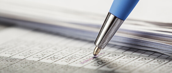 Accounting document with pen, money, coins and checking financial chart. Concept of banking,...