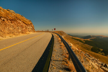 Sharp turn Alpine Transalpina highway in the Romanian mountains. Stunning views from the highway to...