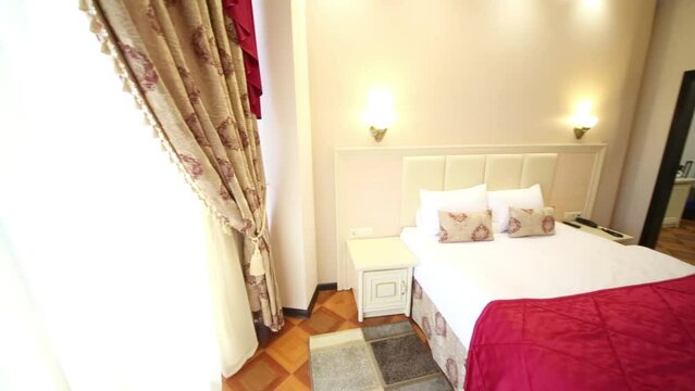 Bedroom with double bed, bedside tables and a chest of drawers