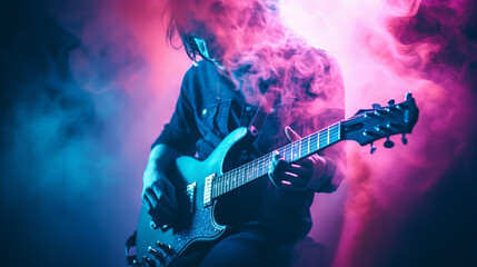 Obraz premium A guitar player making rock during concert. Rock band performs on stage. Guitarist plays solo.