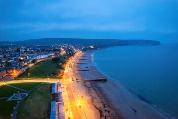 Aerial night view of the famous travel destination, Swanage, Dorset, South West England. blue hour winter