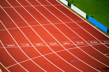 Track and field photo. Red track and numbers at finish line