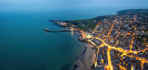 Aerial night view of the famous travel destination, Swanage, Dorset, South West England. blue hour...
