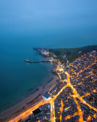 Aerial night view of the famous travel destination, Swanage, Dorset, South West England. blue hour...