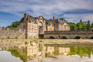 Fototapeta na wymiar |La Ferte Saint Aubin, France, 06-07-2015: Historical castle buildings with old gate and typical french architecture