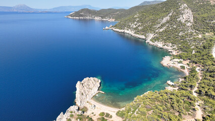 Aerial drone photo of not so famous but paradise  secluded sterna beach with crystal clear emerald sea near iconic lake Vouliagmenis, Loutraki, Greece