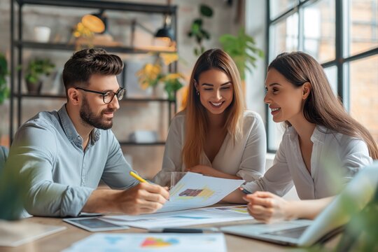 Informal business meeting, young workers sharing ideas.