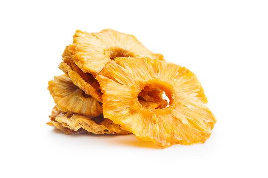 Dried pineapple rings isolated on white background.