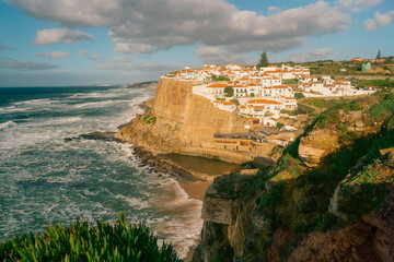 Azenhas do Mar a traditionally Portuguese seaside coast village near Lisbon bath by Atlantic ocean waves.