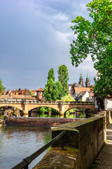 Fototapeta na wymiar Colourful historic old town with half-timbered houses of Nuremberg. Bridges over Pegnitz river. Nurnberg, eastern Bavaria, Germany. Vertical photo
