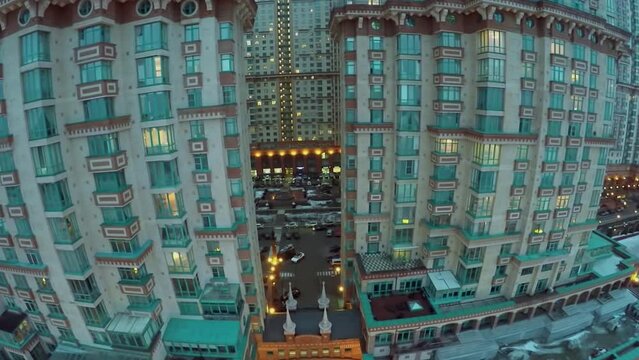 Facade of dwelling complex at winter evening. Aerial view