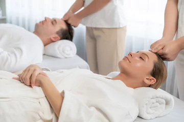 Tuinposter Caucasian couple enjoying relaxing anti-stress head massage and pampering facial beauty skin recreation leisure in dayspa modern light ambient at luxury resort or hotel spa salon. Quiescent © Summit Art Creations